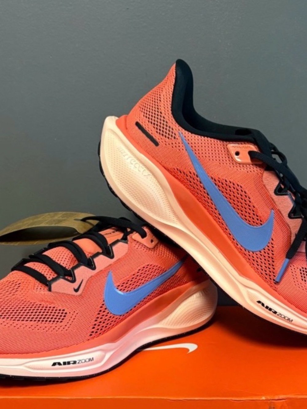 Nike Men's Orange Mesh Athletic Shoes with Blue Swoosh